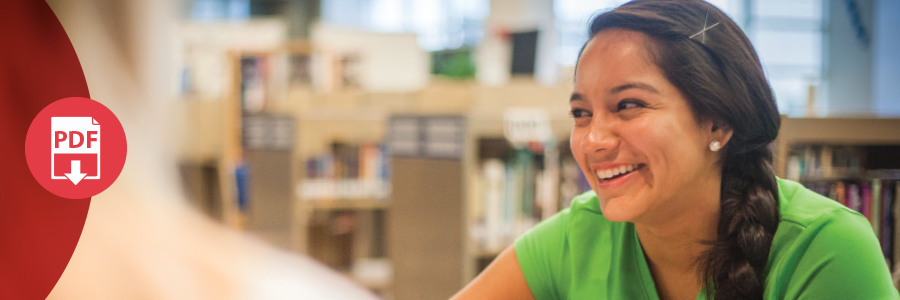 An image of a student working in the library.