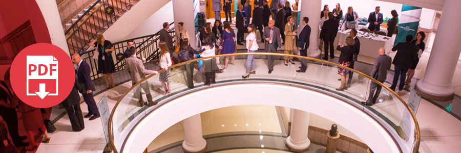 An image of attendees gathering outside a conference room.