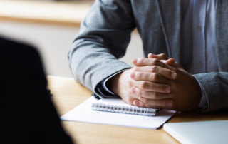 An image of executive working at a table.