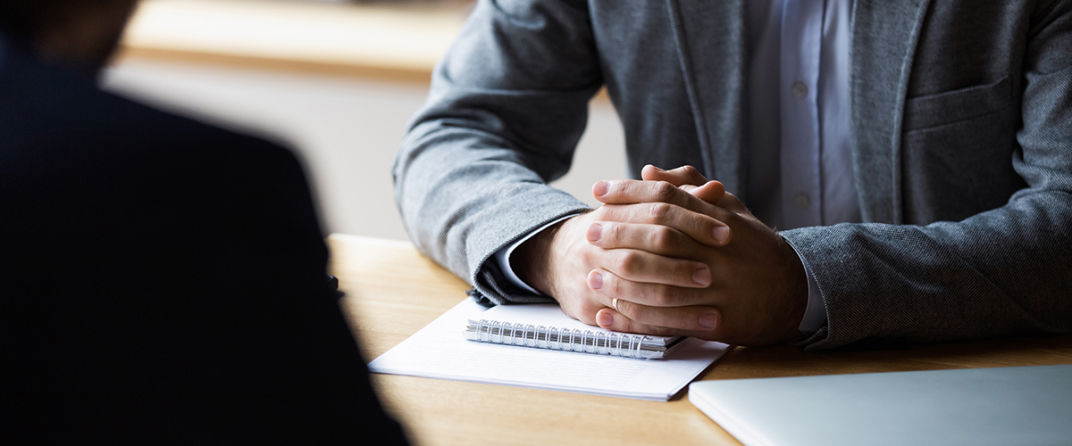 An image of executive working at a table.