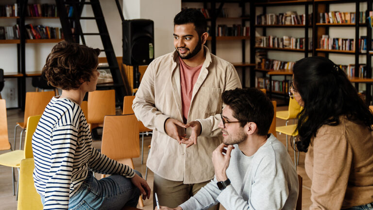 students-collaborating-in-classroom-and-discussing-ideas