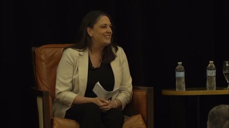 webinar-speaker-smiling-at-camera